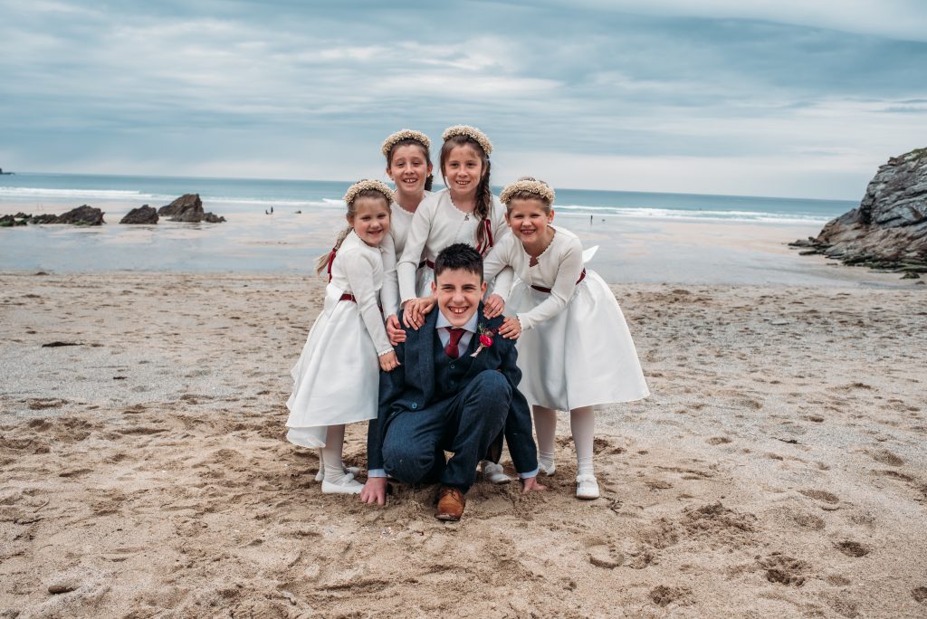 Flower girls at Lusty Glaze. beach wedding