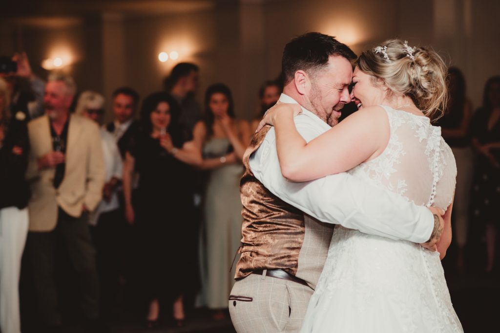 A bride and groom during their first dance at Hatherley Manor Hotel