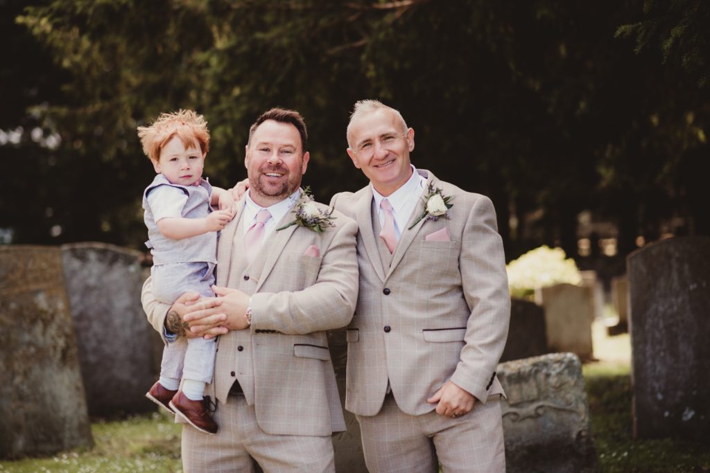 A groom and best man outside Boddington Church