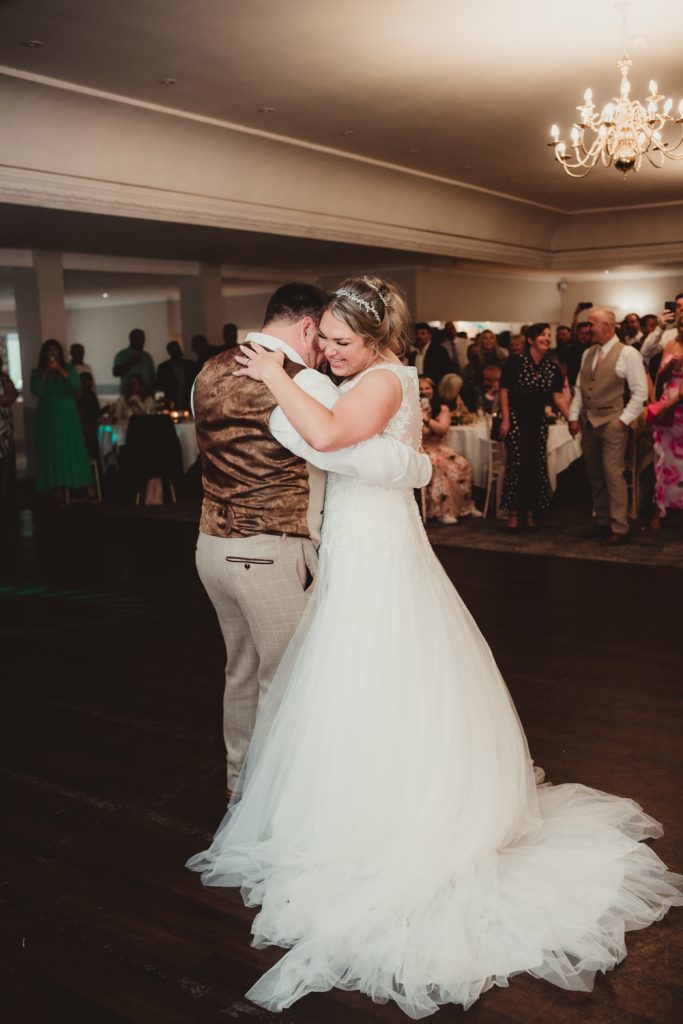 A bride and groom during their first dance at Hatherley Manor Hotel