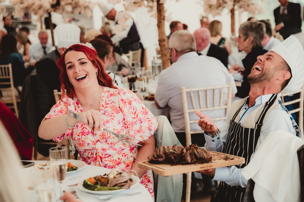 Guests enjoying themselves over dinner at harwick moat weddings