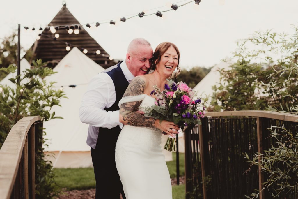 Bride and groom laughing at Hardwick Moat Weddings