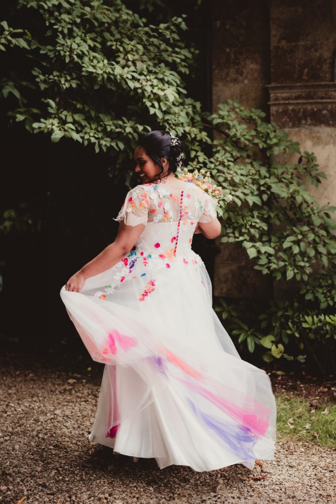 A bride twirling in her coulourful wedding dress at the Matara Centre