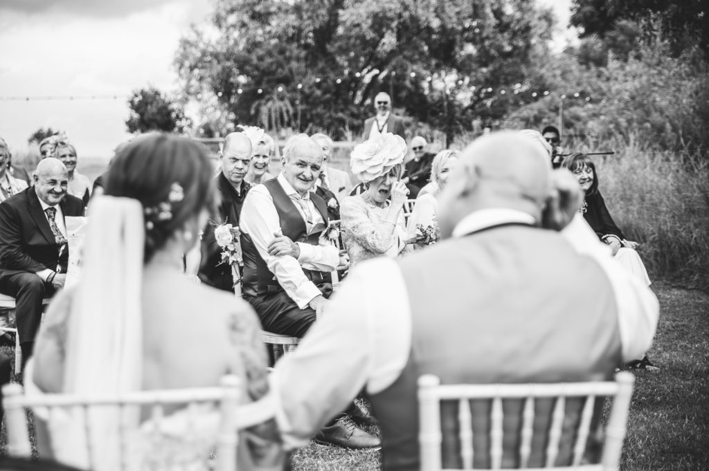 brides dad watching her at Hardwick Moat Weddings